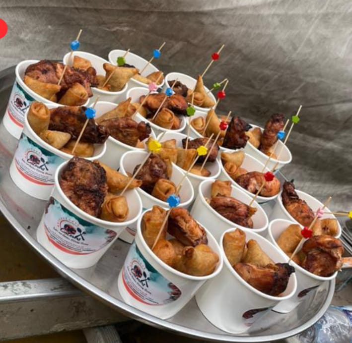 Nature Taste branded small chops cups with samosa and spring rolls